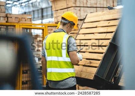 Engineer team standing walking in warehouse examining hardwood material for wood furniture production, Worker check stock, Technician man and woman working on quality control in lumber pallet factory