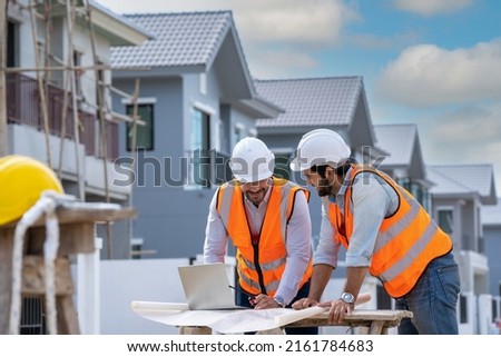 Engineer team work planning in construction site,Construction Contractors building a new home.