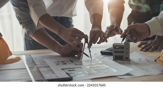 Engineer Teamwork Meeting, Drawing working on blueprint meeting for project working with partner on model building and engineering tools in working site, Construction and structure concept