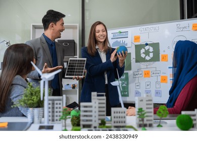 Engineer Teamwork Meeting, with partner on model building at company office working technology, Renewable energy-based green businesses and global warming. - Powered by Shutterstock