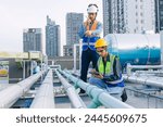 engineer teamwork technician workers service hotel boiler tank hot water supply pipe system. team working safety checking maintenance pipeline heating water delivery line at roof top outdoor.