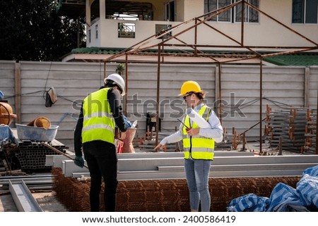 Engineer technician inspects building structure Engineer technicians are looking at and analyzing unfinished construction projects. In order to be in accordance with the design