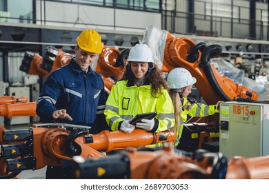 Engineer Technician Working with Robotic Arm in Futuristic Factory: Automation Technology for Efficient Production and Assembly in Manufacturing, Driving Innovation Control in Industrial Plant