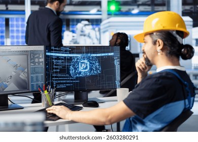 Engineer training AI models at workstation in solar panel production facility to identify manufacturing problems. Factory worker using machine learning to improve process optimization