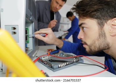 Engineer Training Male Apprentice On Cnc Machine