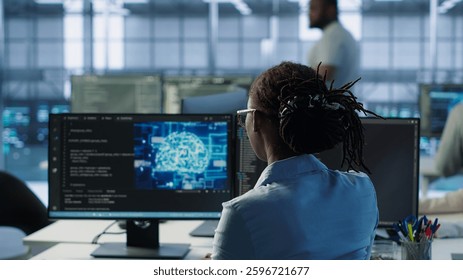 Engineer typing on computer in server hub, monitoring data center energy consumption using AI software. Technician inspecting rackmounts in server room using artificial intelligence tech, camera A - Powered by Shutterstock - Get 15% off with code: PIKWIZARD15