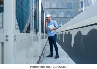 Engineer under checking the industry chilled water fan coil unit air conditioner is water cooling tower air chiller HVAC system of large industrial building to control air system 