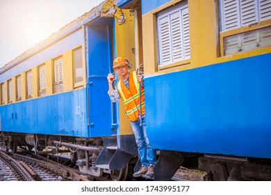 A Engineer Under Inspection And Checking Construction Process Railway Work On Rail Train Station By Radio Communication ,Engineer Wearing Safety Uniform And Safety Helmet In Work.