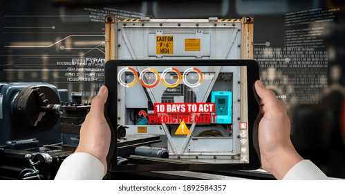 Engineer use augmented reality software in smart factory production line with automated application . Futuristic machinery in working in concept of Industry 4.0 or 4th industrial revolution.