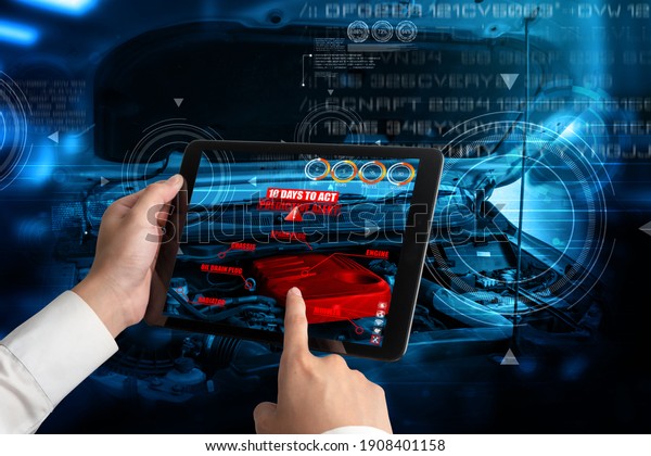 Engineer\
use augmented reality software to monitor parts of car vehicle with\
automated application . Futuristic machinery in working in concept\
of Industry 4.0 or 4th industrial\
revolution.