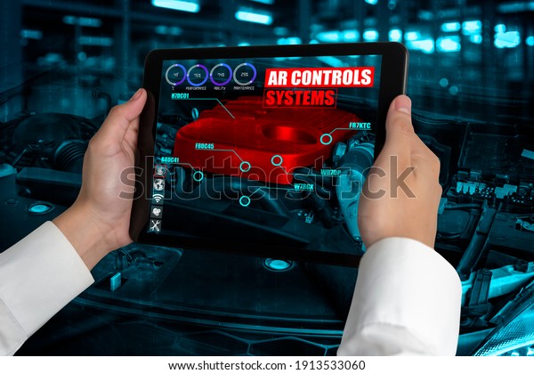 Engineer\
use augmented reality software to monitor parts of car vehicle with\
automated application . Futuristic machinery in working in concept\
of Industry 4.0 or 4th industrial\
revolution.