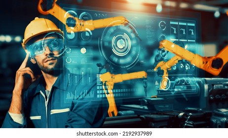 Engineer use cybernated robotic software to control industry robot arm in factory . Automation manufacturing process controlled by specialist using IOT software connected to internet network . - Shutterstock ID 2192937989