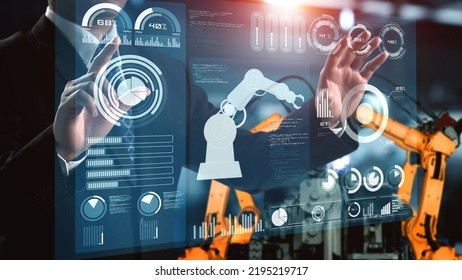 Engineer use cybernated robotic software to control industry robot arm in factory . Automation manufacturing process controlled by specialist using IOT software connected to internet network . - Shutterstock ID 2195219717