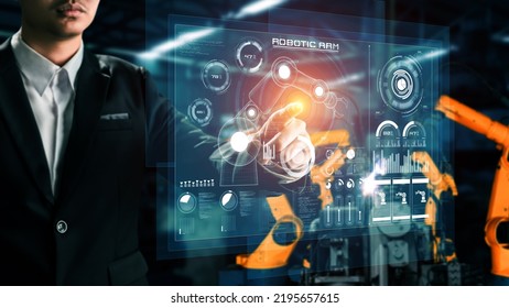 Engineer use cybernated robotic software to control industry robot arm in factory . Automation manufacturing process controlled by specialist using IOT software connected to internet network . - Shutterstock ID 2195657615