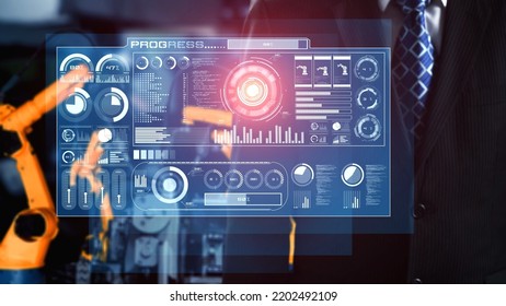 Engineer use cybernated robotic software to control industry robot arm in factory . Automation manufacturing process controlled by specialist using IOT software connected to internet network . - Shutterstock ID 2202492109