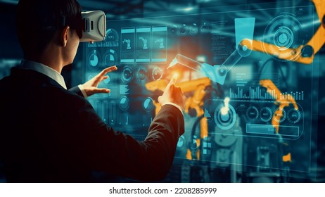Engineer use cybernated robotic software to control industry robot arm in factory . Automation manufacturing process controlled by specialist using IOT software connected to internet network . - Shutterstock ID 2208285999