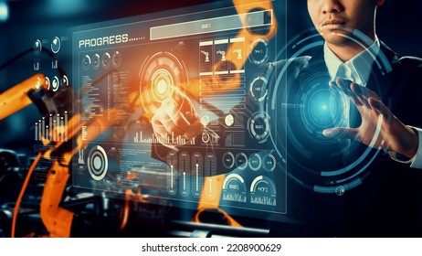 Engineer use cybernated robotic software to control industry robot arm in factory . Automation manufacturing process controlled by specialist using IOT software connected to internet network . - Shutterstock ID 2208900629