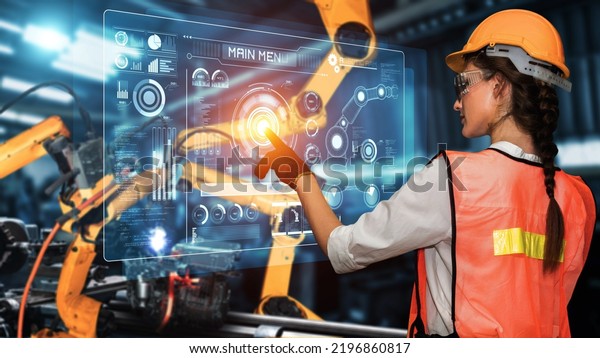 Engineer use cybernated robotic software to control\
industry robot arm in factory . Automation manufacturing process\
controlled by specialist using IOT software connected to internet\
network .