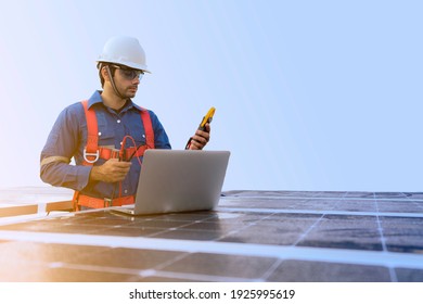 An Engineer Use A Laptop Computer To Examine, Inspection The Solar Panels At Roof Top Of Home And Home Office ,concept Of Economic Energy And Cost Saving