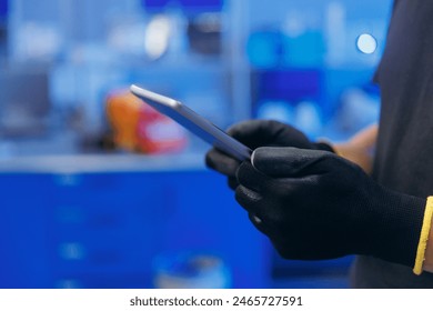 Engineer uses computer tablet. Modern technologies of building materials, laboratory for quality control of concrete and bricks.