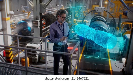 An Engineer Uses A Tablet With A Holographic Innovative Application, To Model And Design And Monitor A 3D Model Of An Aircraft Engine While On An Automated Robotic Line At An Aerospace Factory