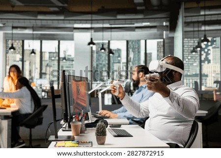 Engineer uses VR glasses to design futuristic video game lobby, creating a fantasy world in cyberspace with software and virtual reality assets, supporting game development and virtual asset design