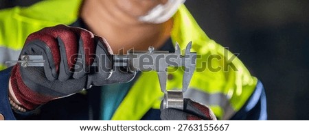 Engineer Using Caliper for Manual Inspection of Metal Part Machinist Checking Equipment in a Dirty and Messy Workshop Engineer with Safety Glasses Using Precision Tool on Machinery.