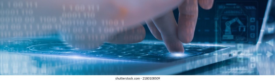 Engineer using computer,control automated robot arm machine in factory,digital network machine learning operation,concept business and industry 4.0,artificial intelligence or AI 5G network technology