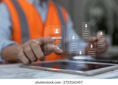 Engineer using digital tablet to review virtual resumes and candidate profiles. Concept of digital recruitment, HR technology, skill evaluation smart hiring process in modern workforce.