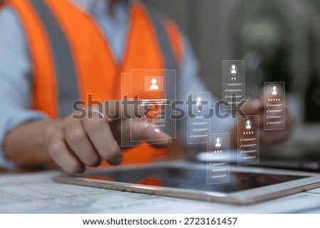 Engineer using digital tablet to review virtual resumes and candidate profiles. Concept of digital recruitment, HR technology, skill evaluation smart hiring process in modern workforce.