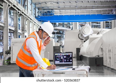 Engineer Using Laptop Computer For Maintenance Equipment In Thermal Power Plant Factory