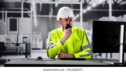 Engineer Using PC In Automated Semiconductor Assembly Line - Powered by Shutterstock