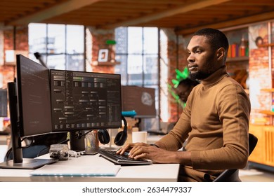 IT engineer using PC in innovative startup office and programming languages to build applications. Software development agency worker debugging and optimizing code on computer