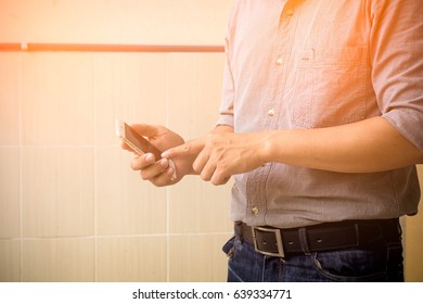 Engineer using smart phone. - Powered by Shutterstock