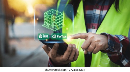 Engineer using smartphone for ConTech and BIM construction technology to manage smart building projects and infrastructure innovation