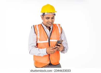 Engineer using smartphone on white background. - Powered by Shutterstock