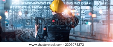 Engineer using tablet checking and analysis data systems electrics of track on railway on networking, Modern Industrial and transportation. 