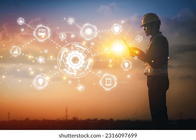 Engineer using tablet to inspect work at job site. concept of technology usage In industrial applications, remote data retrieval, large databases. network link.