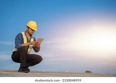 Engineer using tablet to inspect work at job site. concept of technology usage In industrial applications, remote data retrieval, large databases. network link. - Powered by Shutterstock - Get 15% off with code: PIKWIZARD15