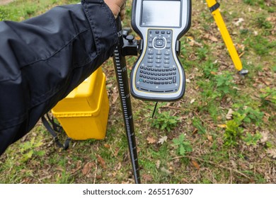 An Engineer Using a Topography GPS Device