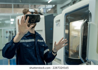 Engineer are using virtual AR to maintain of human robot and CNC machine at the 4.0 Smart Factory.