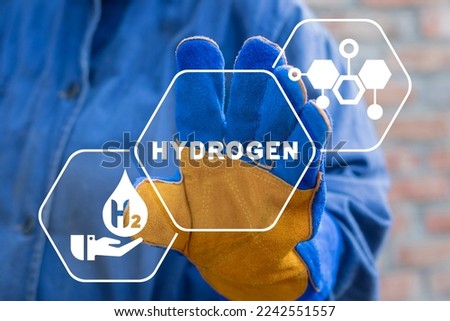 Engineer using virtual touchscreen presses word: HYDROGEN. Concept of hydrogen production. H2 Fuel Modern Manufacturing. Industrial ecology zero emissions technology hydrogen generation.