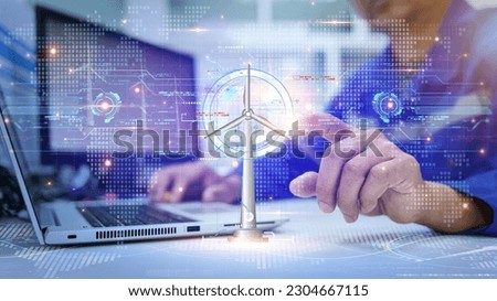 Engineer view a dashboard hud The program shows the total power generated by wind turbines and displays them on the hologram screen. Clean energy technology and renewable energy.