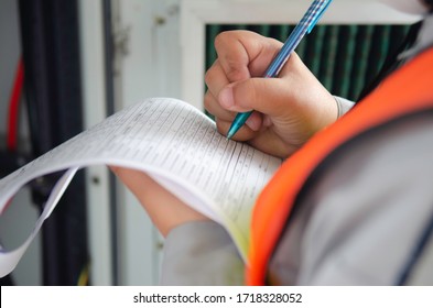 Engineer Wear Safety Equipment Write And Record Inspection Report,worker Write Maintenance Check List For Preventive Maintenance.
