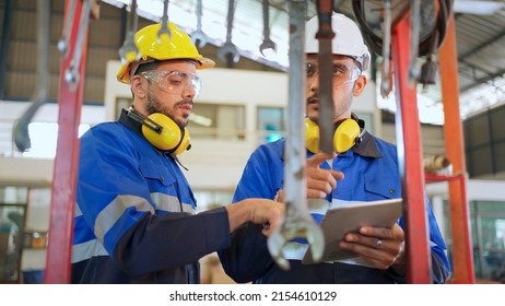 Engineer Wearing Safety Helmet And Glasses Standing In The Production Of Manufacturing Factory. Choosing Wrench And Check Size. Industrial And Cleaning Concept. Happy Job And Good Workplace