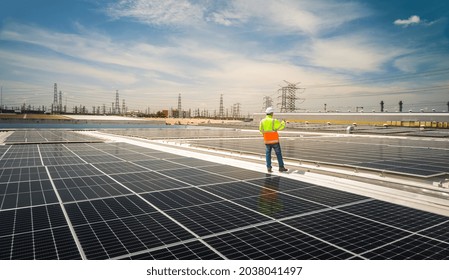 Engineer wearing unifrom and helmet inspect and check solar cell panel ,solar cell is ecology energy sunlight power installation for industrail ,alternative environment power concept.