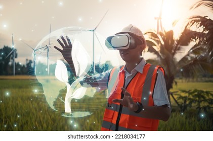 Engineer wearing VR technology simulation control graphical world interaction inspecting pure environment energy providing electricity power to homes and cities, eco environmentally sustainable power