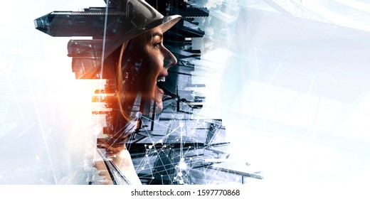 Engineer woman against modern cityscape - Shutterstock ID 1597770868