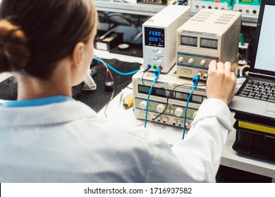 Engineer Woman In Electronics Lab Testing EMC Compliance Of A Product