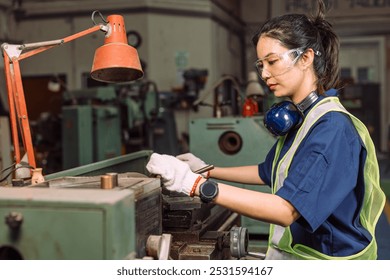 Engineer women working in Lathe shop with metal machinery lathe milling machine, expert skillful industry worker female. - Powered by Shutterstock